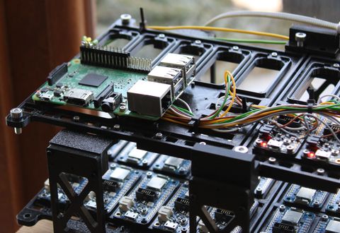 Raspberry Pi 3 on the top shelf with the Feather boards mounted below
