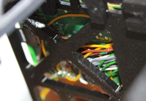 Wiring bundle routed through the frame cross-members